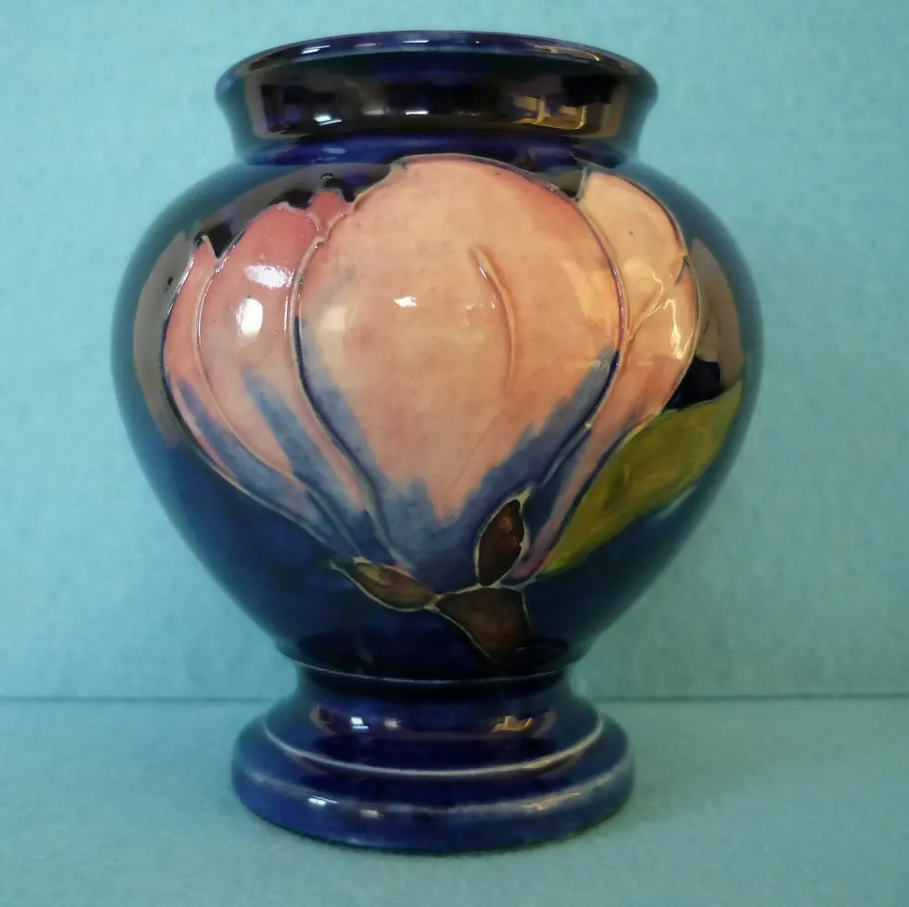 A Moorcroft Baluster Shaped Vase in Magnolia by Walter Moorcroft