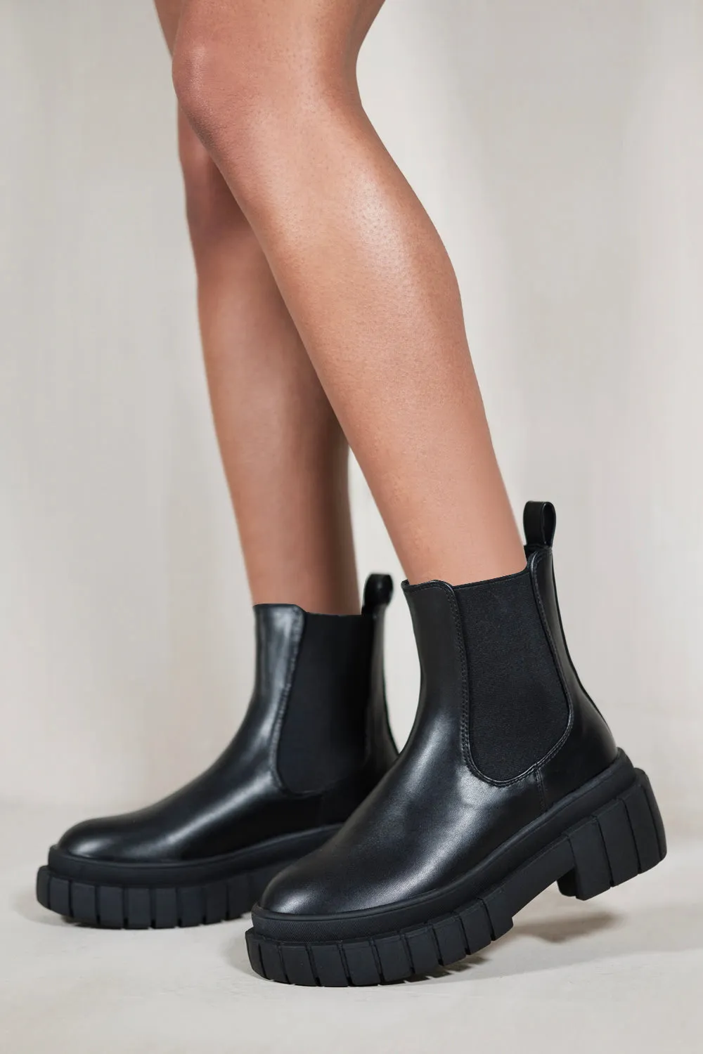 ELOISE CLEATED PLATFORM CHELSEA ANKLE BOOTS IN BLACK FAUX LEATHER